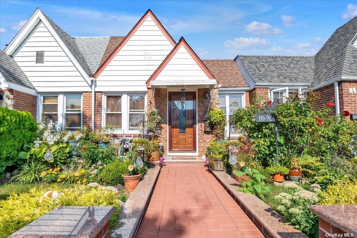 a view of a house with potted plants