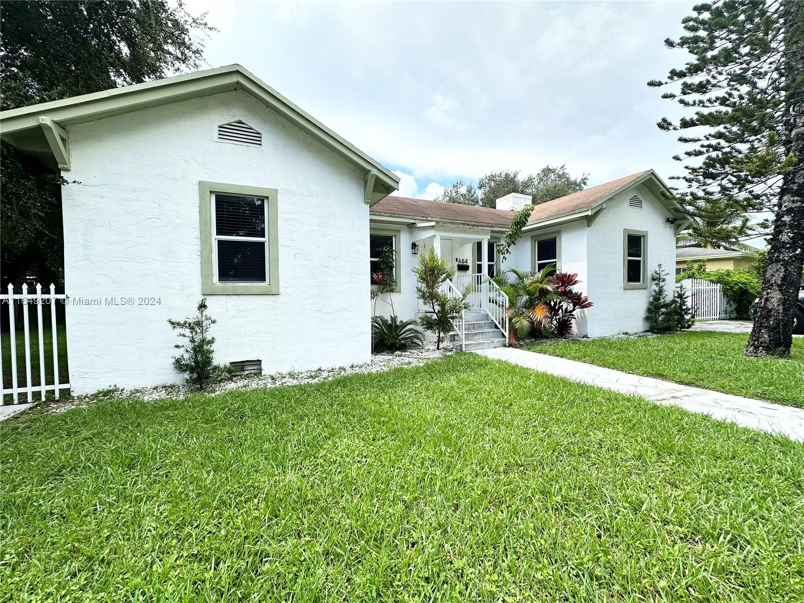 a front view of house with yard