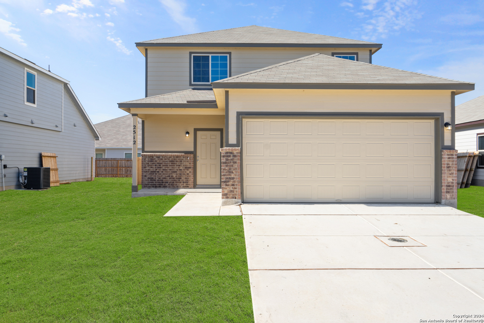 a view of front door of house with yard