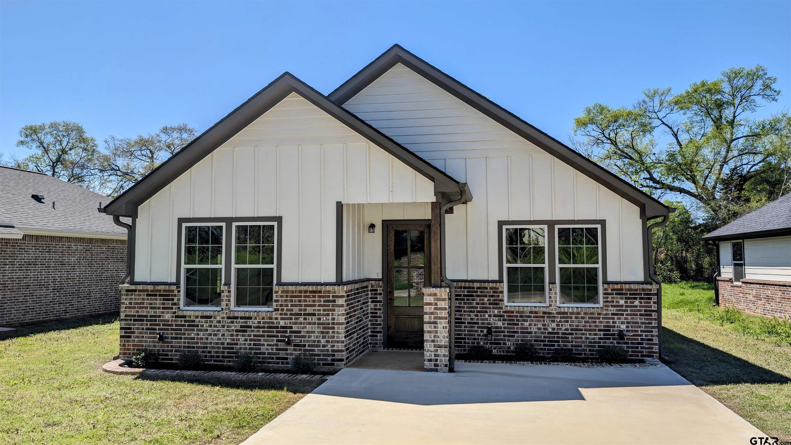 a front view of a house with garage