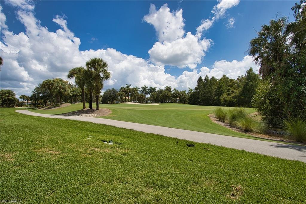 View of home's community with a lawn