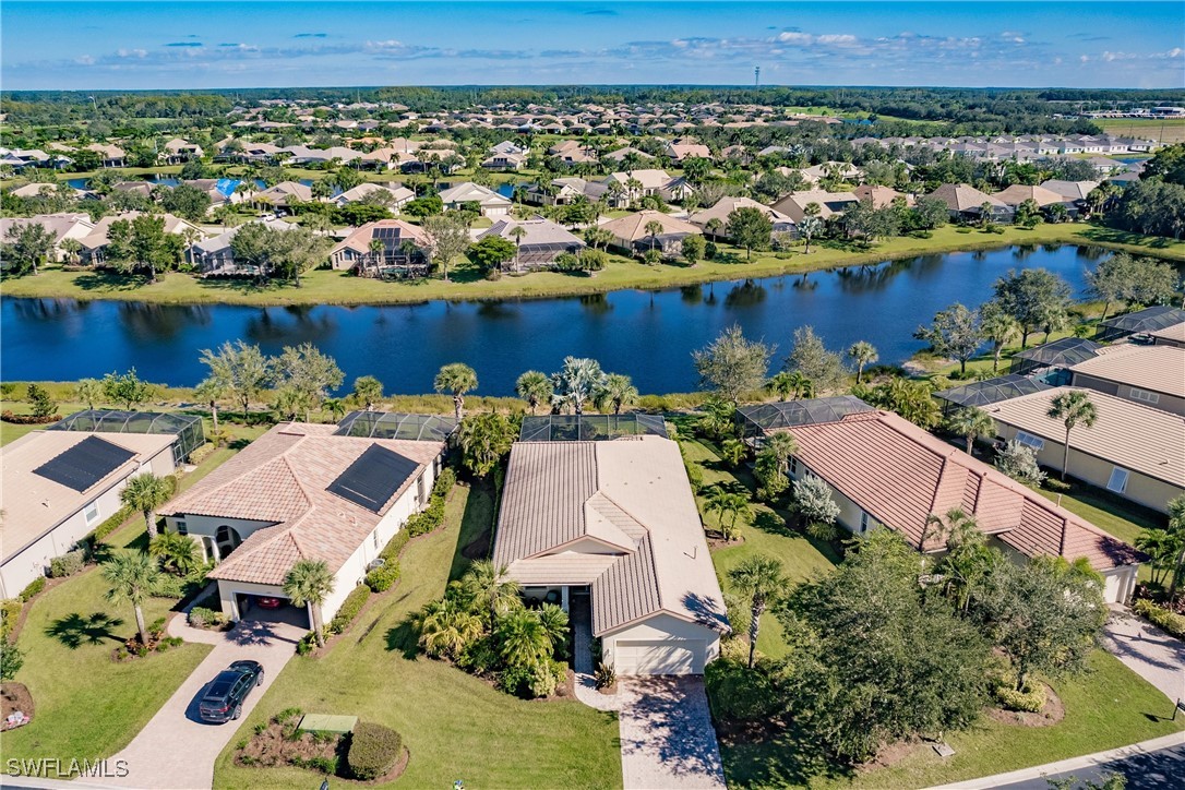 an aerial view of a house with a lake view