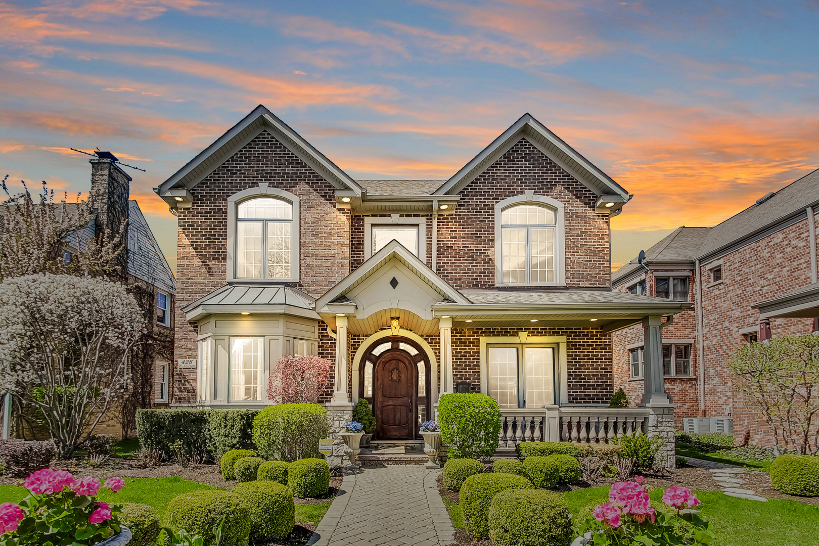 a front view of a house with a yard