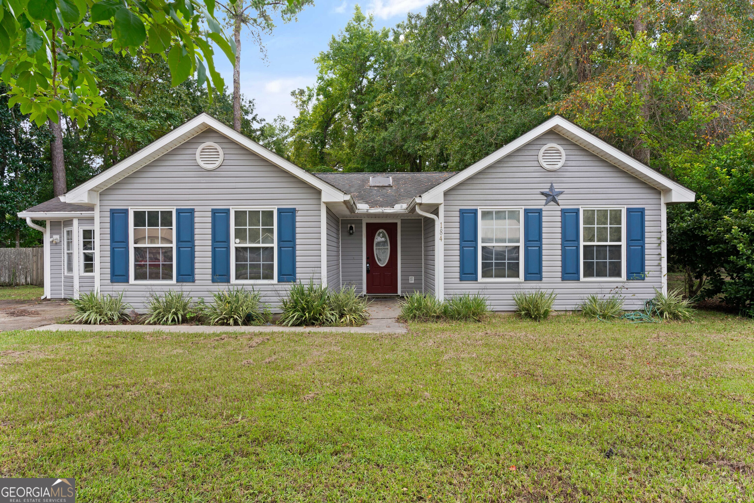 a view of a house with a yard