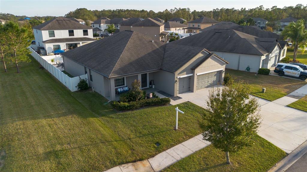 a aerial view of a house with a yard