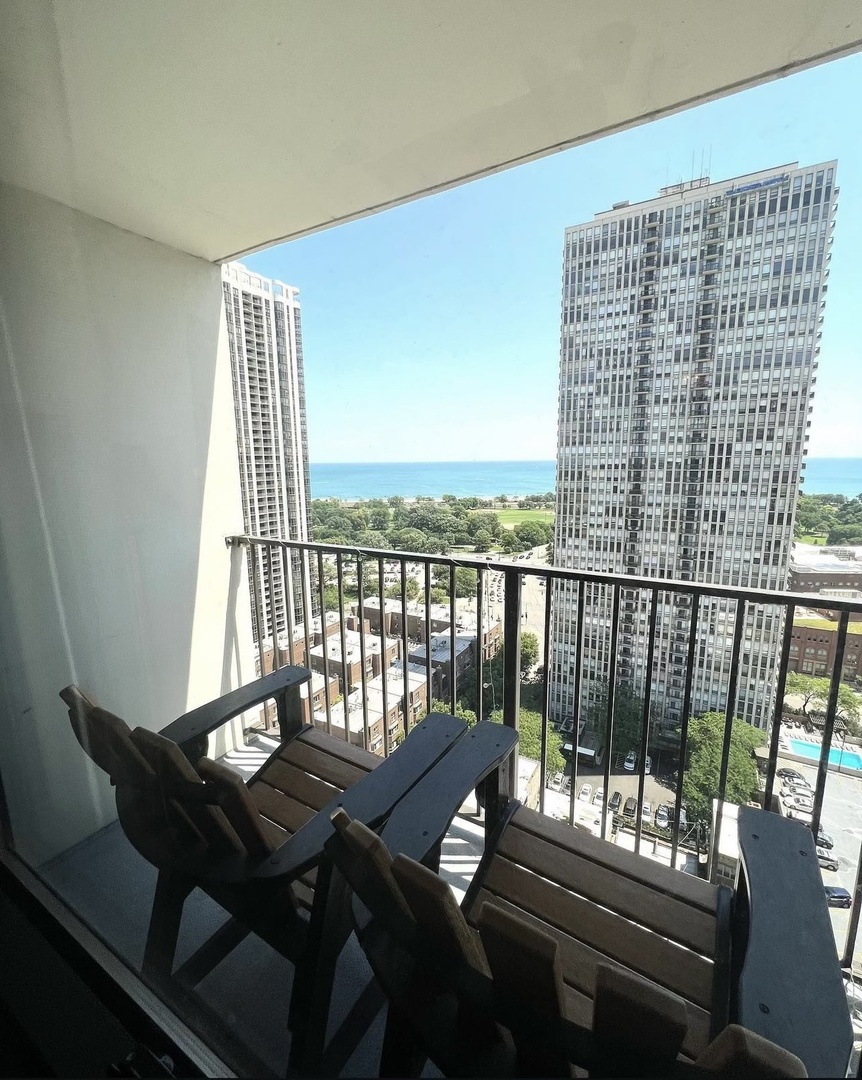 a view of a balcony with chairs