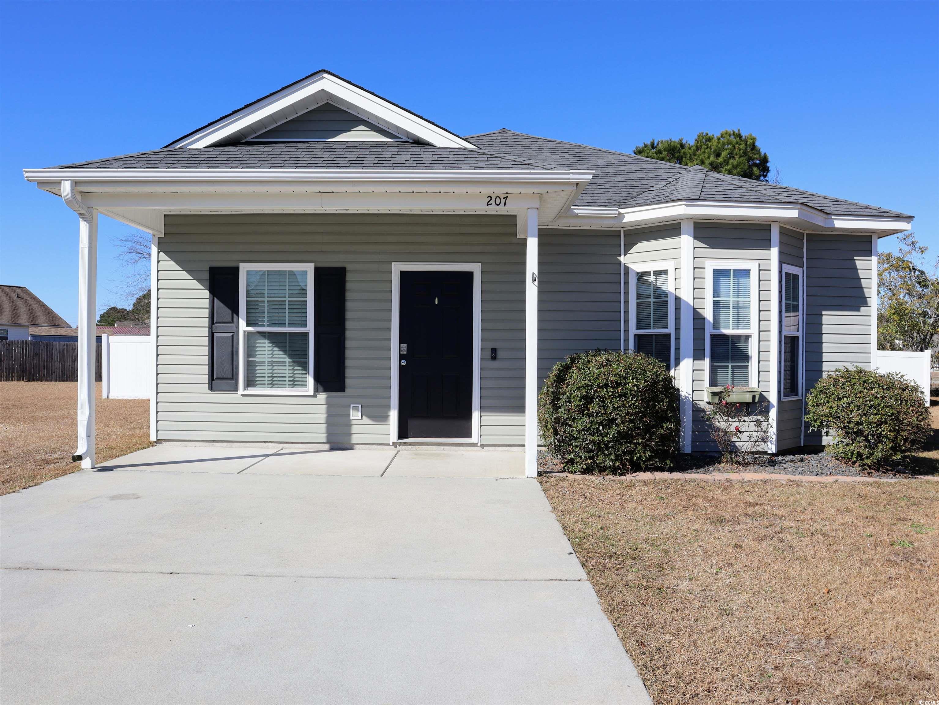 View of front of property featuring a porch and a