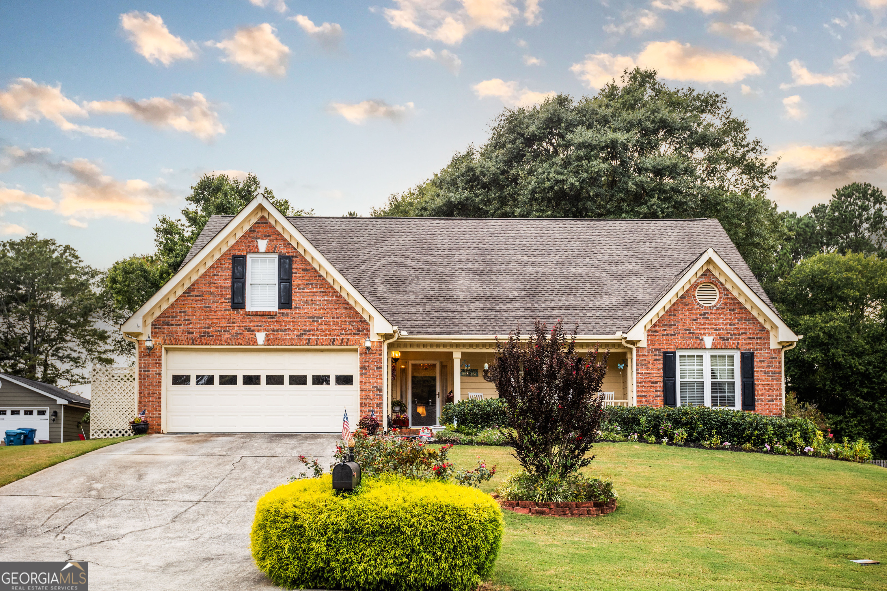 a front view of a house with yard