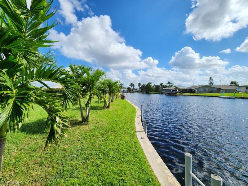 a view of a lake with a yard