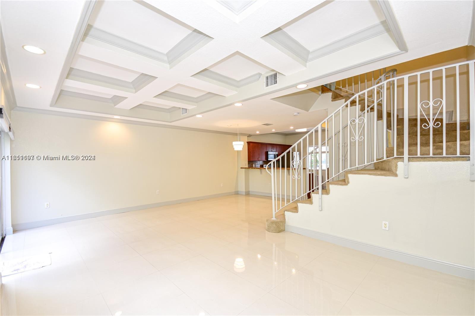 a view of a hallway with stairs