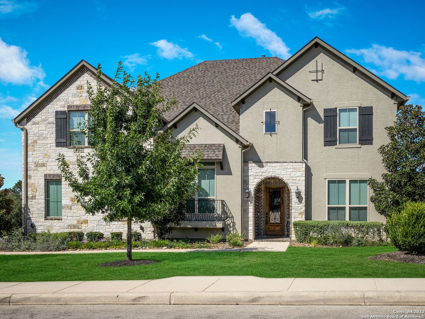 a front view of a house with a yard