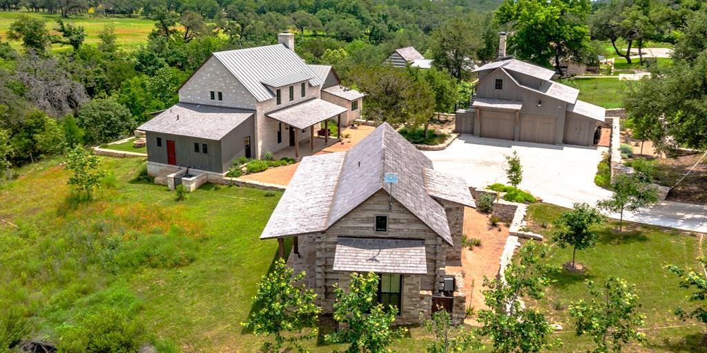 an aerial view of a house with garden space and street view