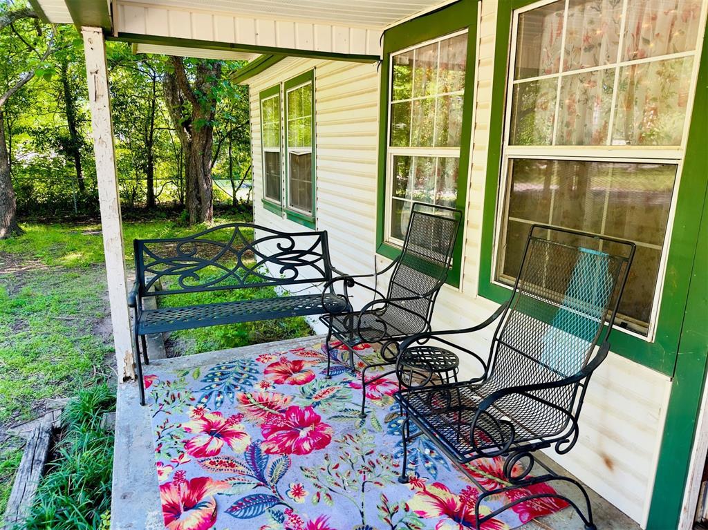 a view of an chairs and table in the garden