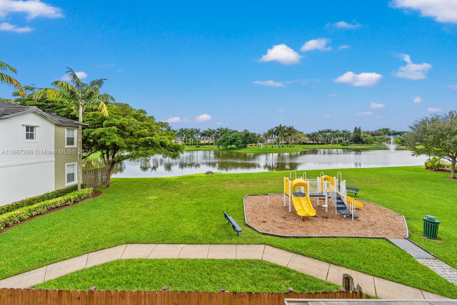 a view of a garden with a lake