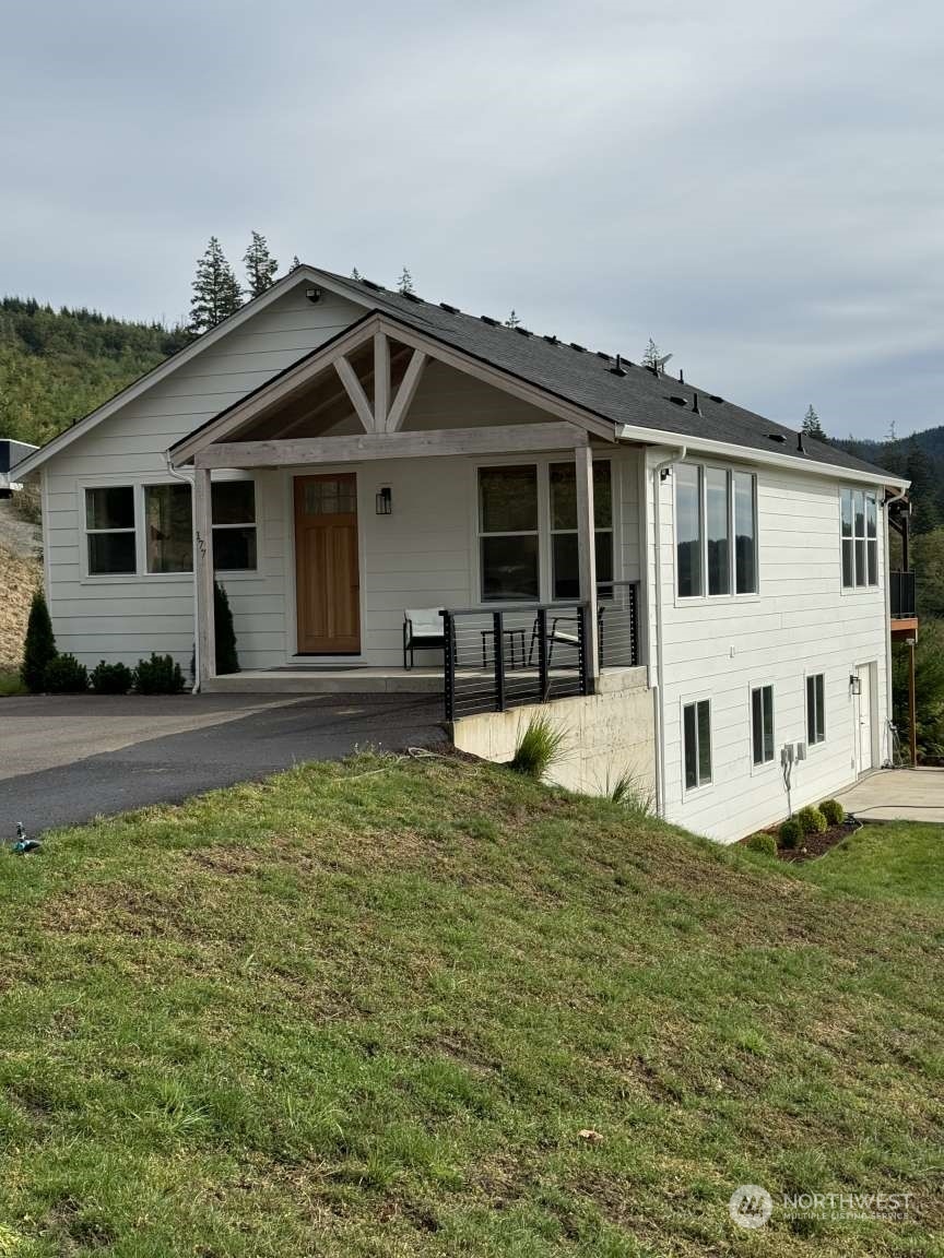 a front view of a house with a yard