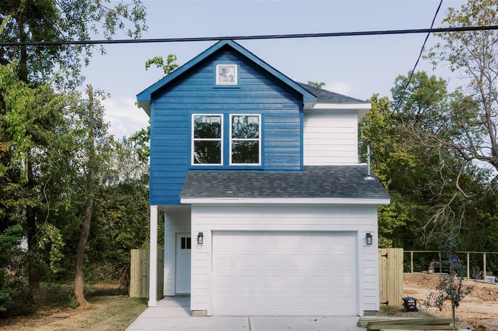 a front view of a house with garage