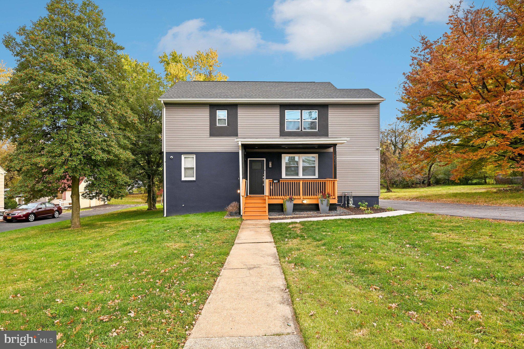 a front view of a house with yard