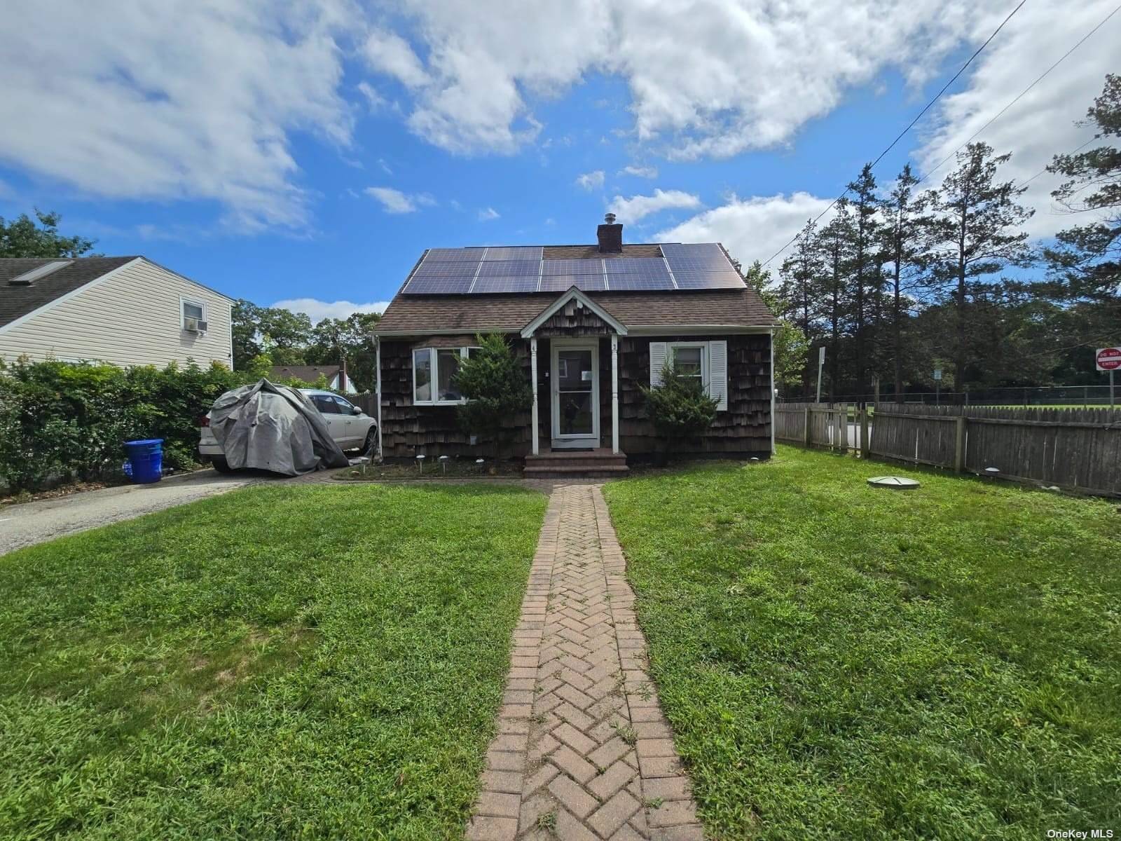 front view of a house with a yard