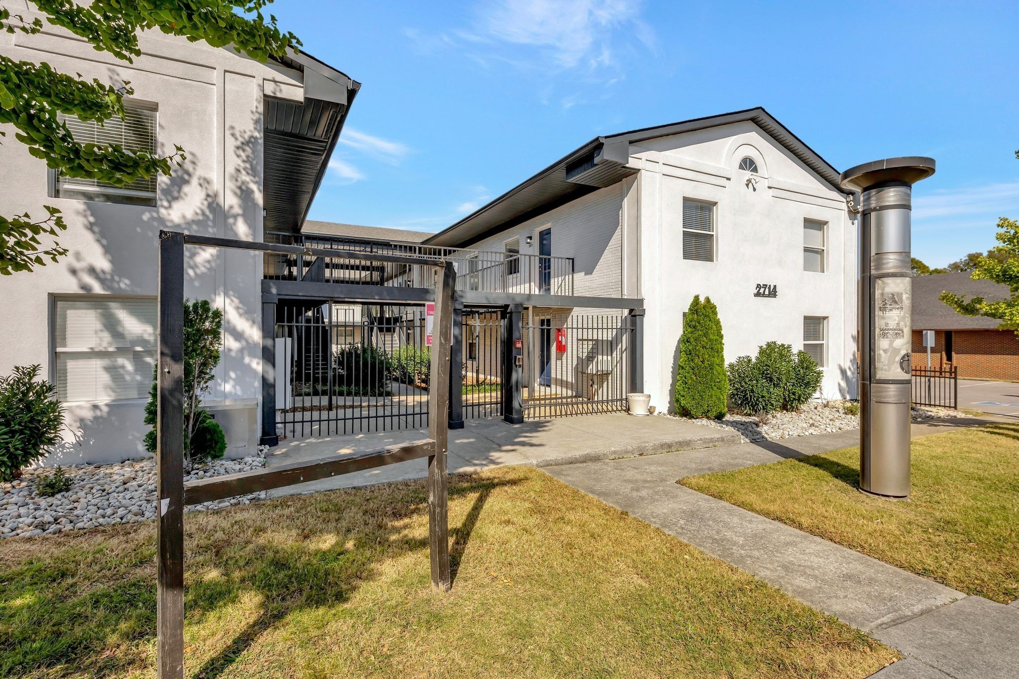 a front view of a house with small yard