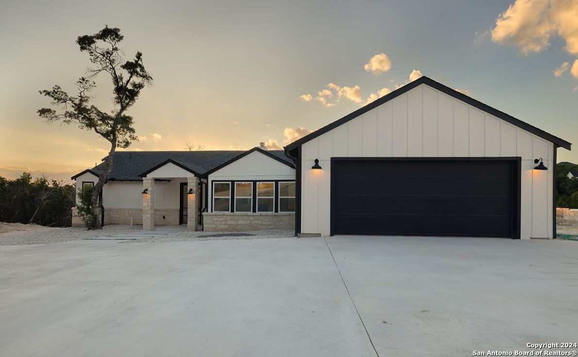 a front view of a house with a garage