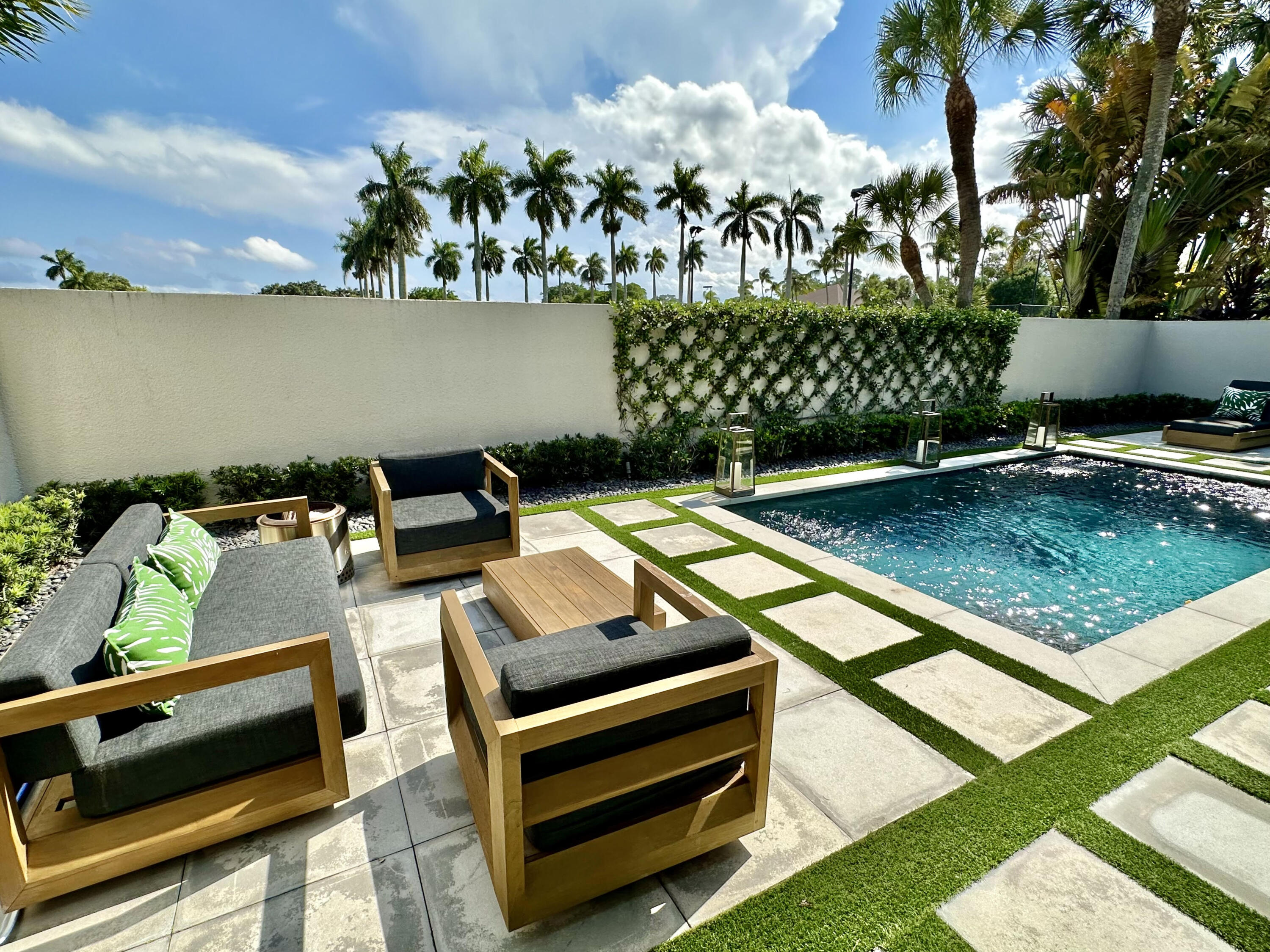 a view of a backyard with sitting area