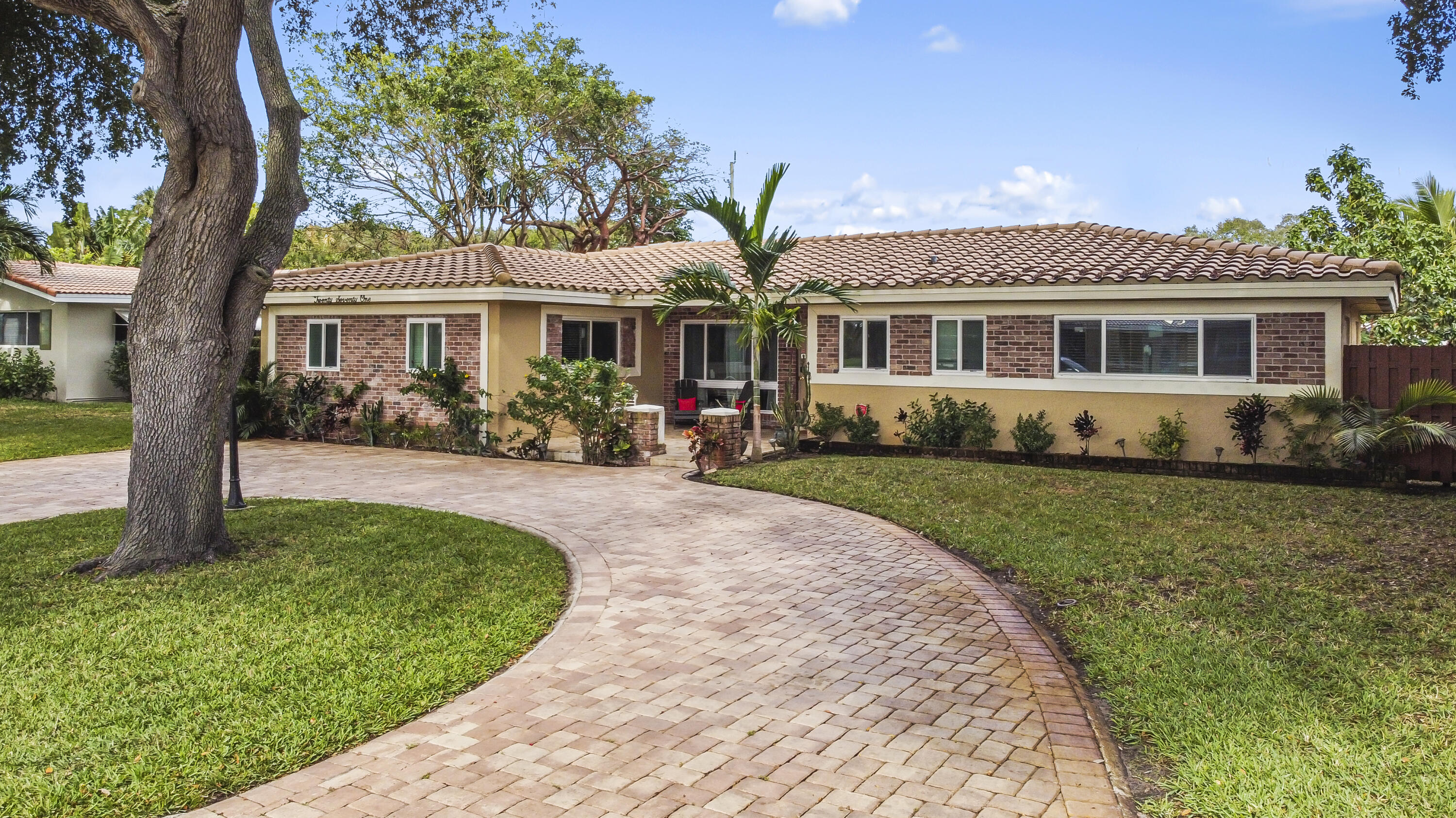 a front view of house with yard and green space