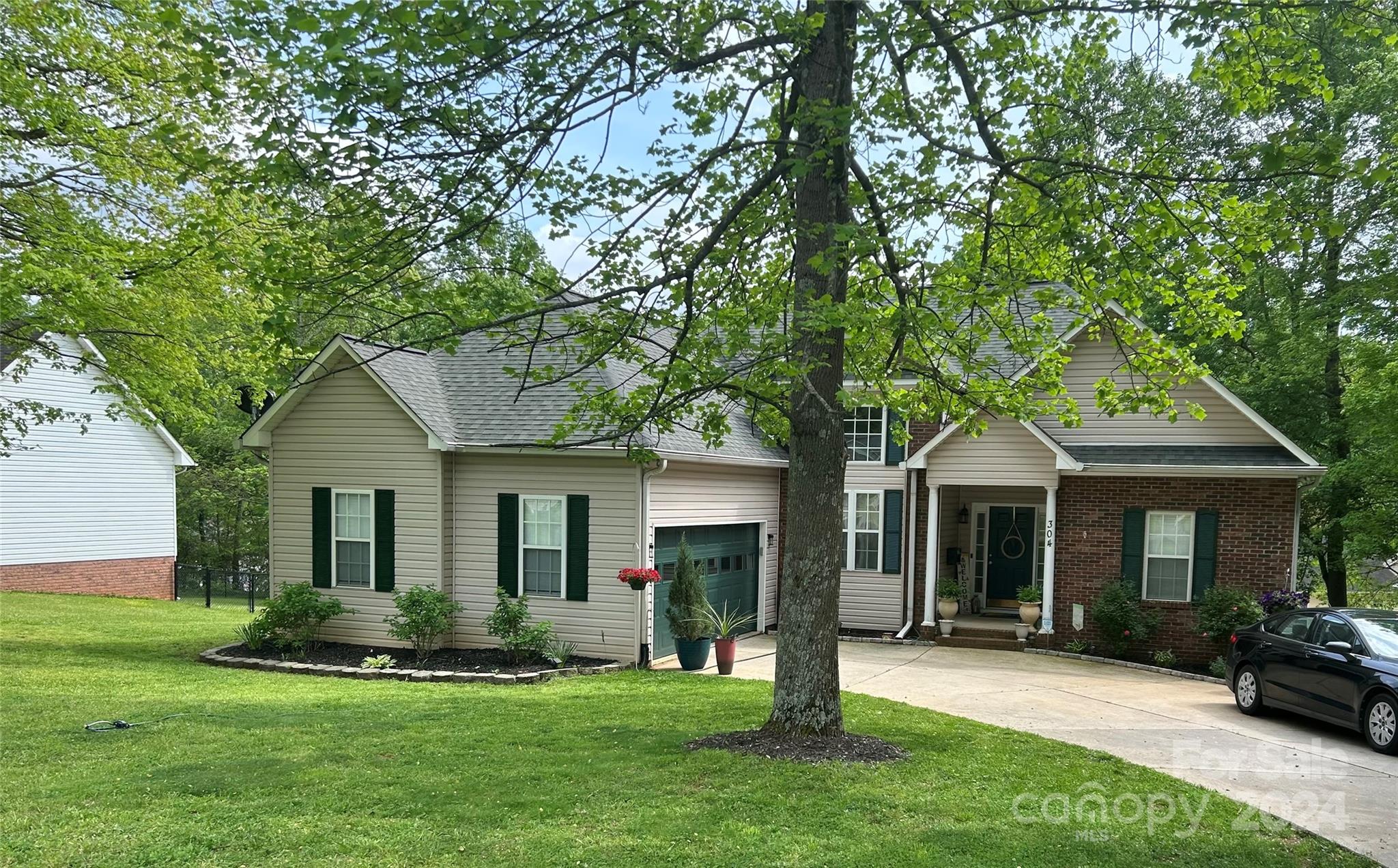 a front view of a house with a yard and porch