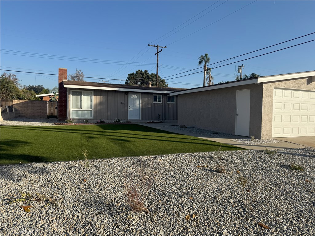 a view of a house with a garden