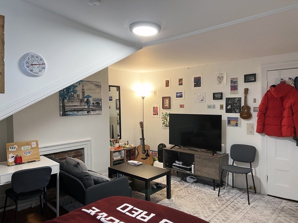 a view of a livingroom with furniture and a flat screen tv