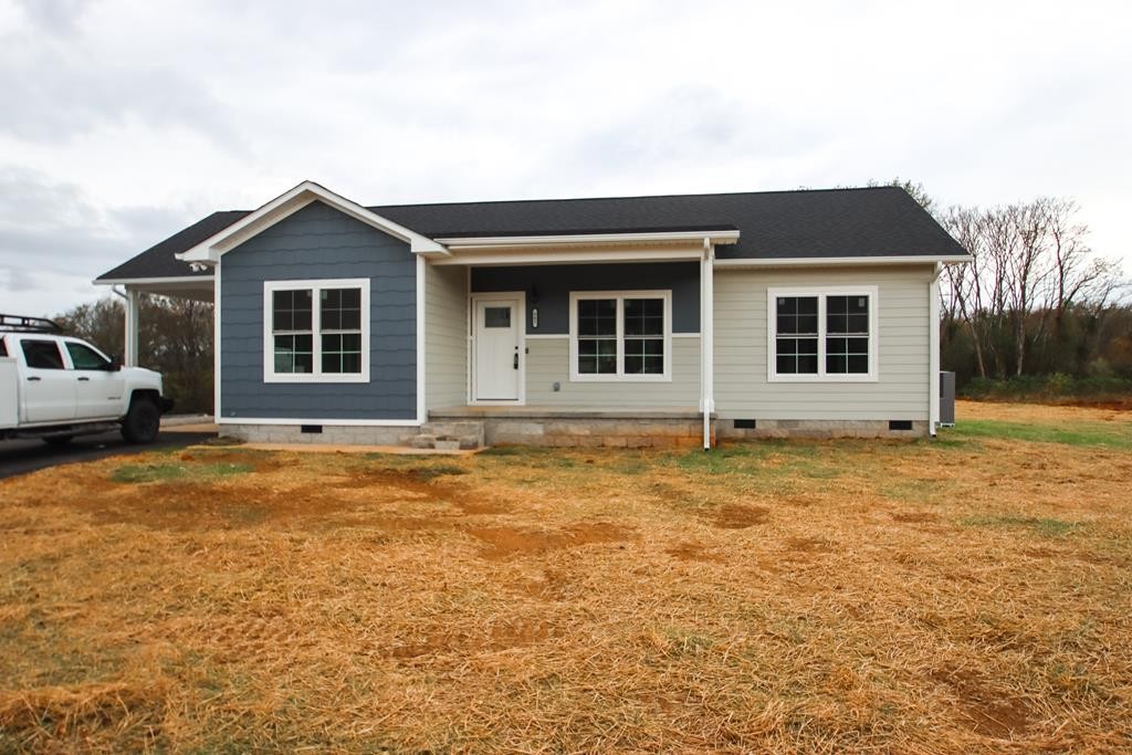 a house with yard in front of it