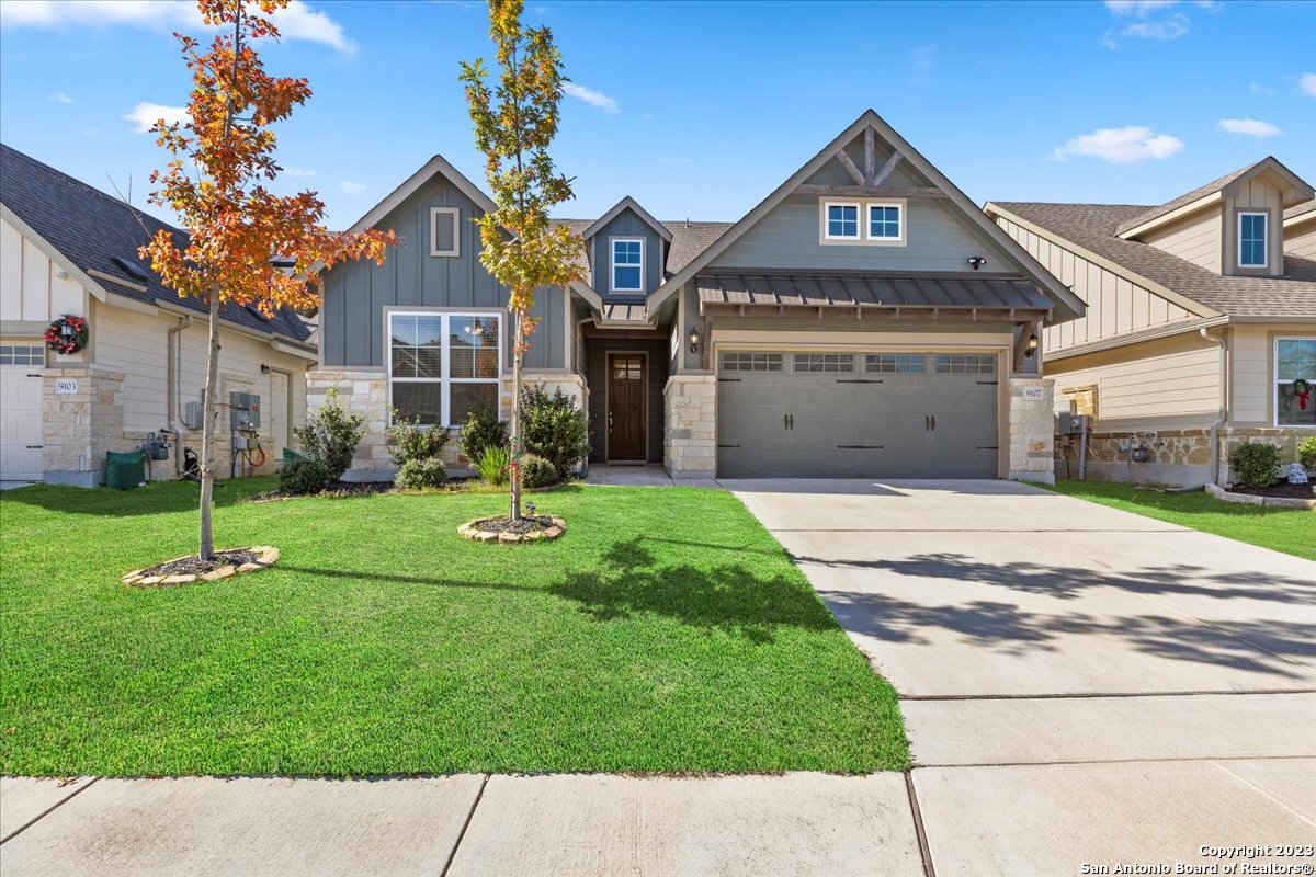 a front view of a house with a yard