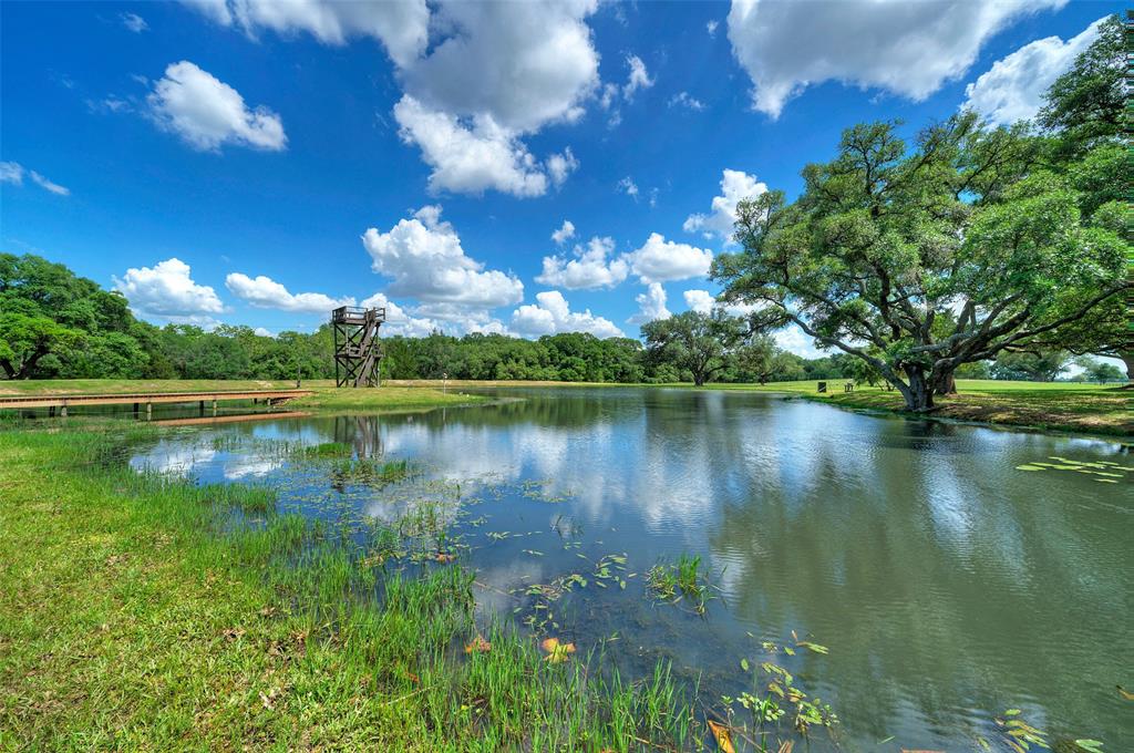 a view of a lake with a big yard