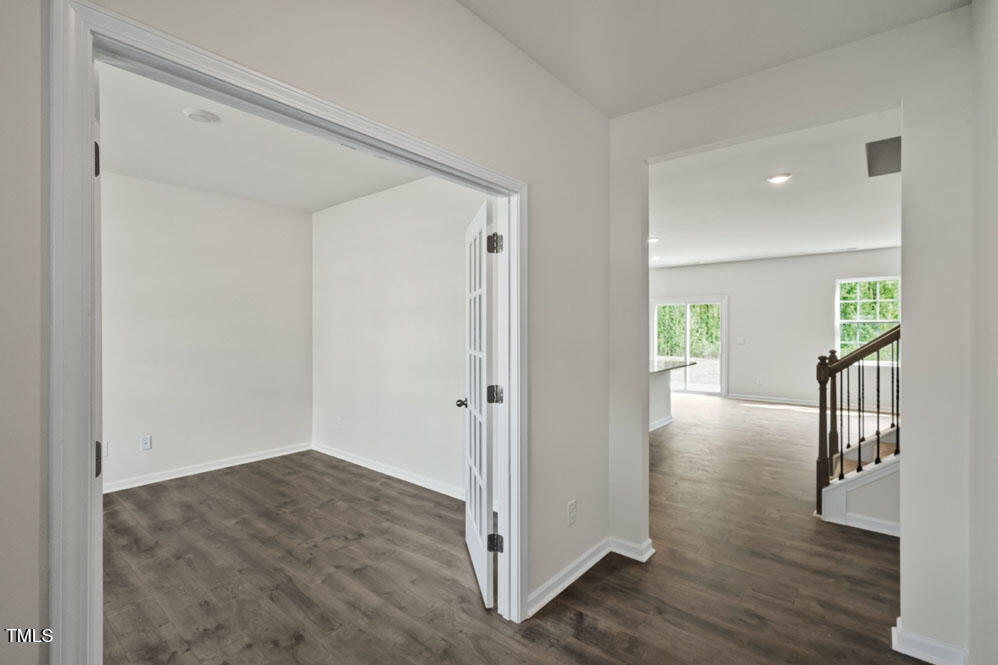 a view of livingroom with hardwood floor and stairs