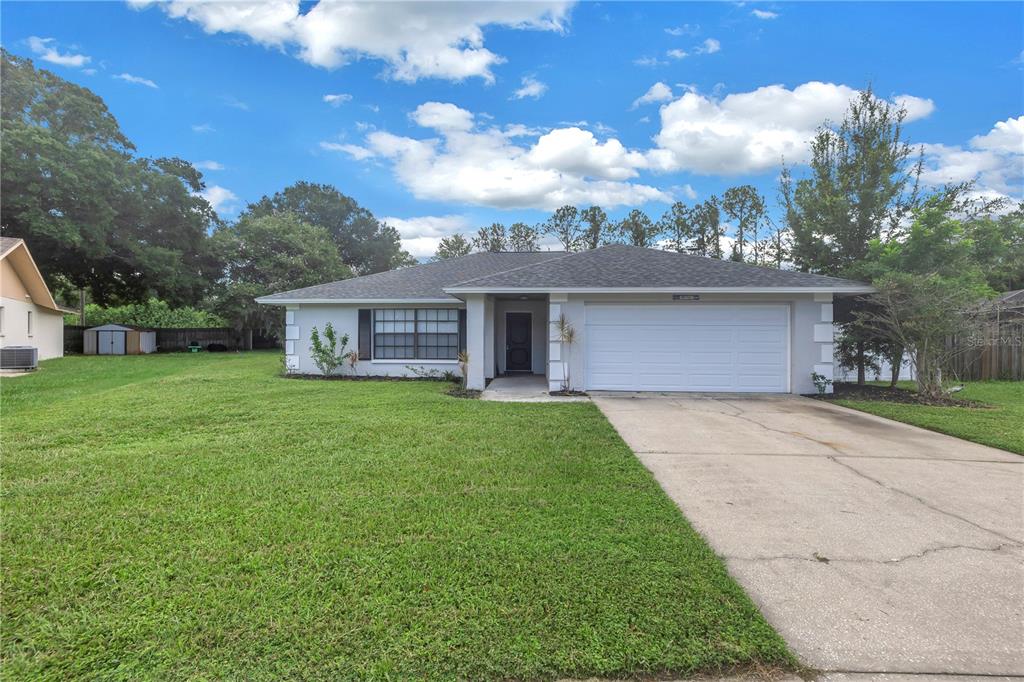 a view of a house with a yard