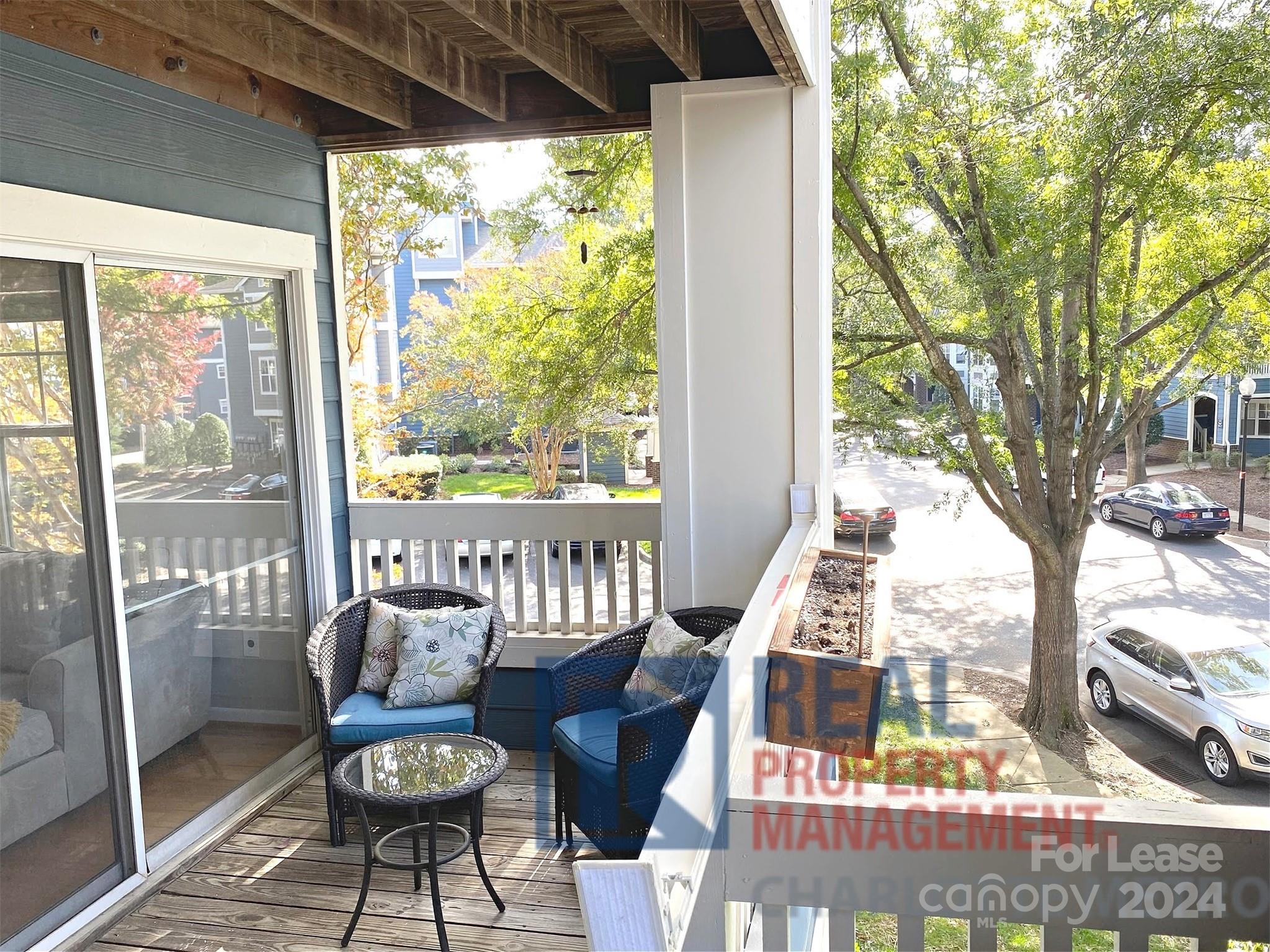 a view of balcony with wooden floor