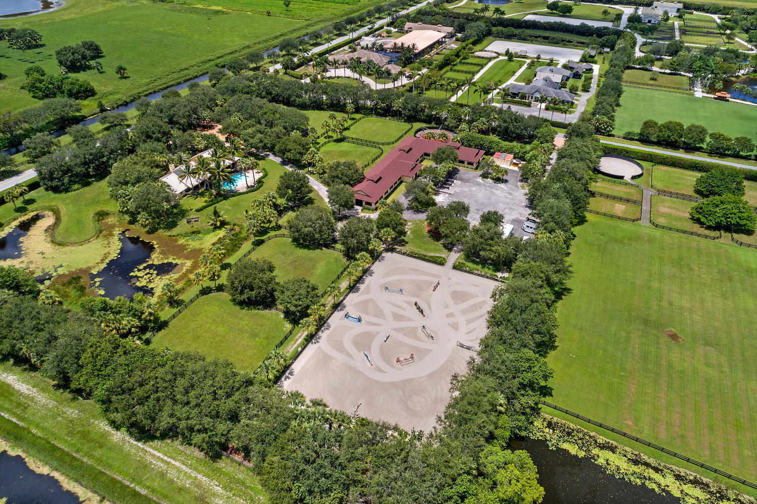 an aerial view of a residential houses with outdoor space and street view