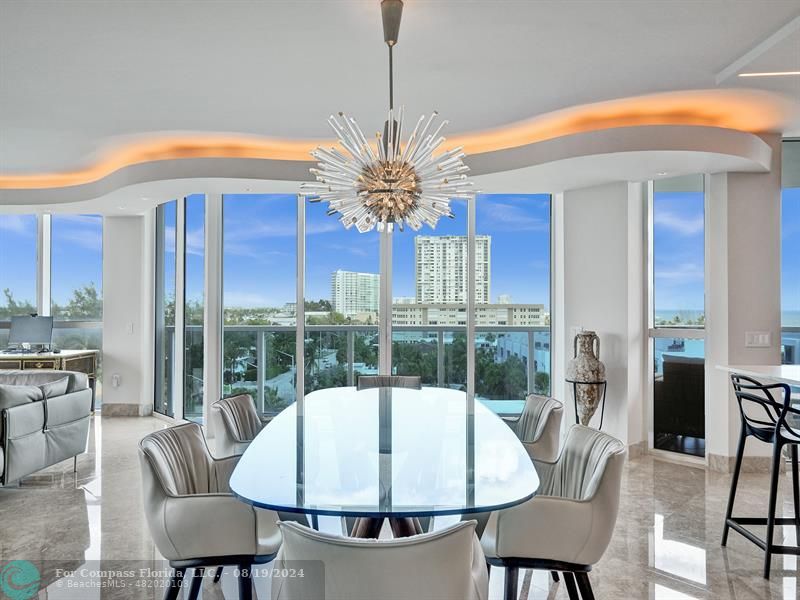 a view of a dining room with furniture window and outside view