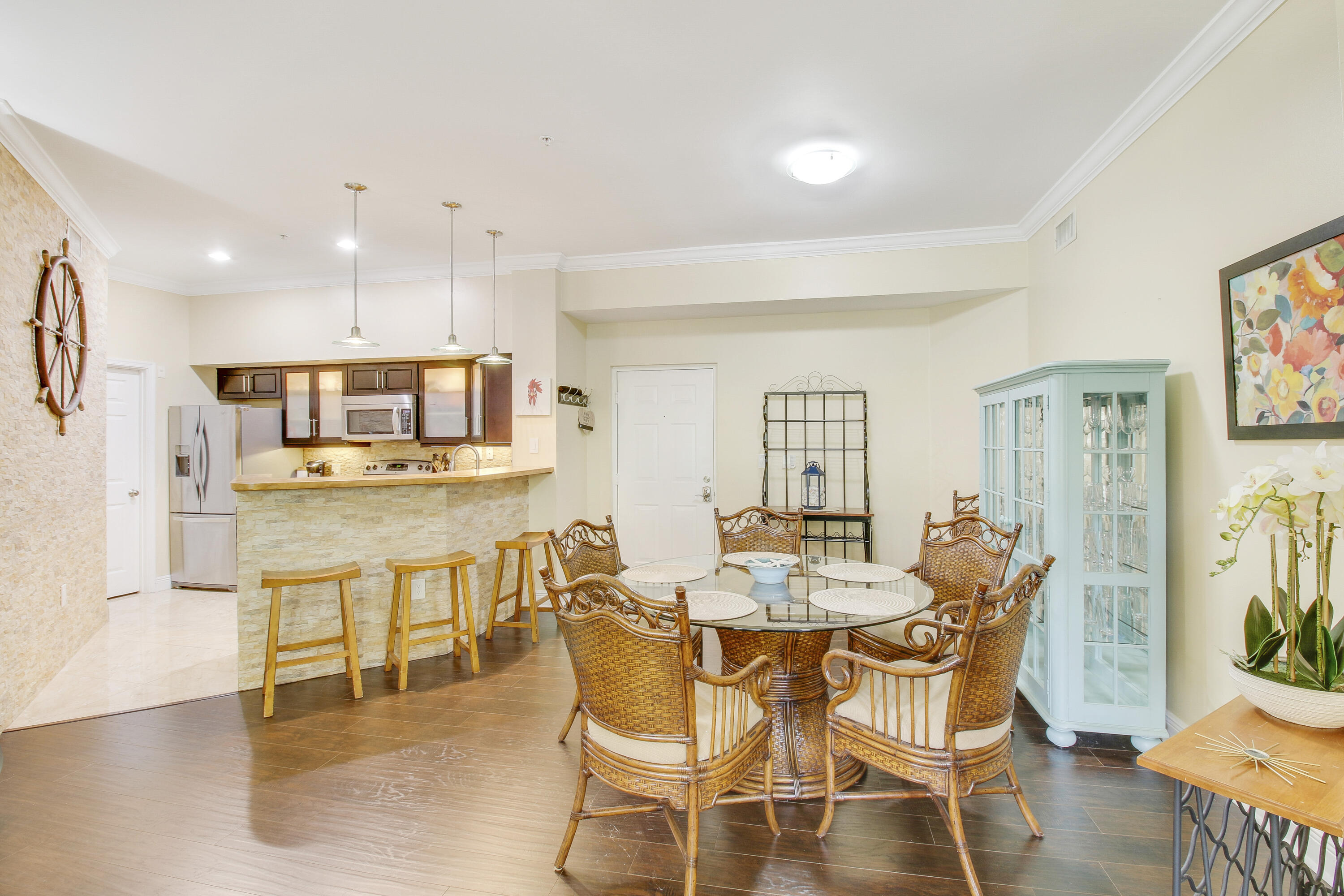 a dining room with furniture and wooden floor