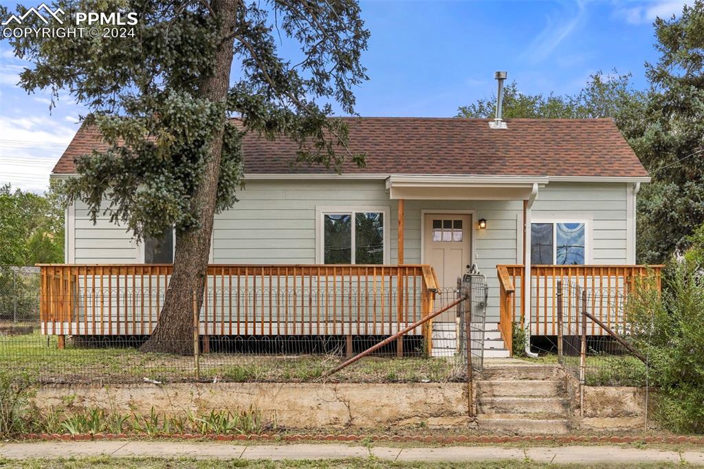 Bungalow-style house with a deck