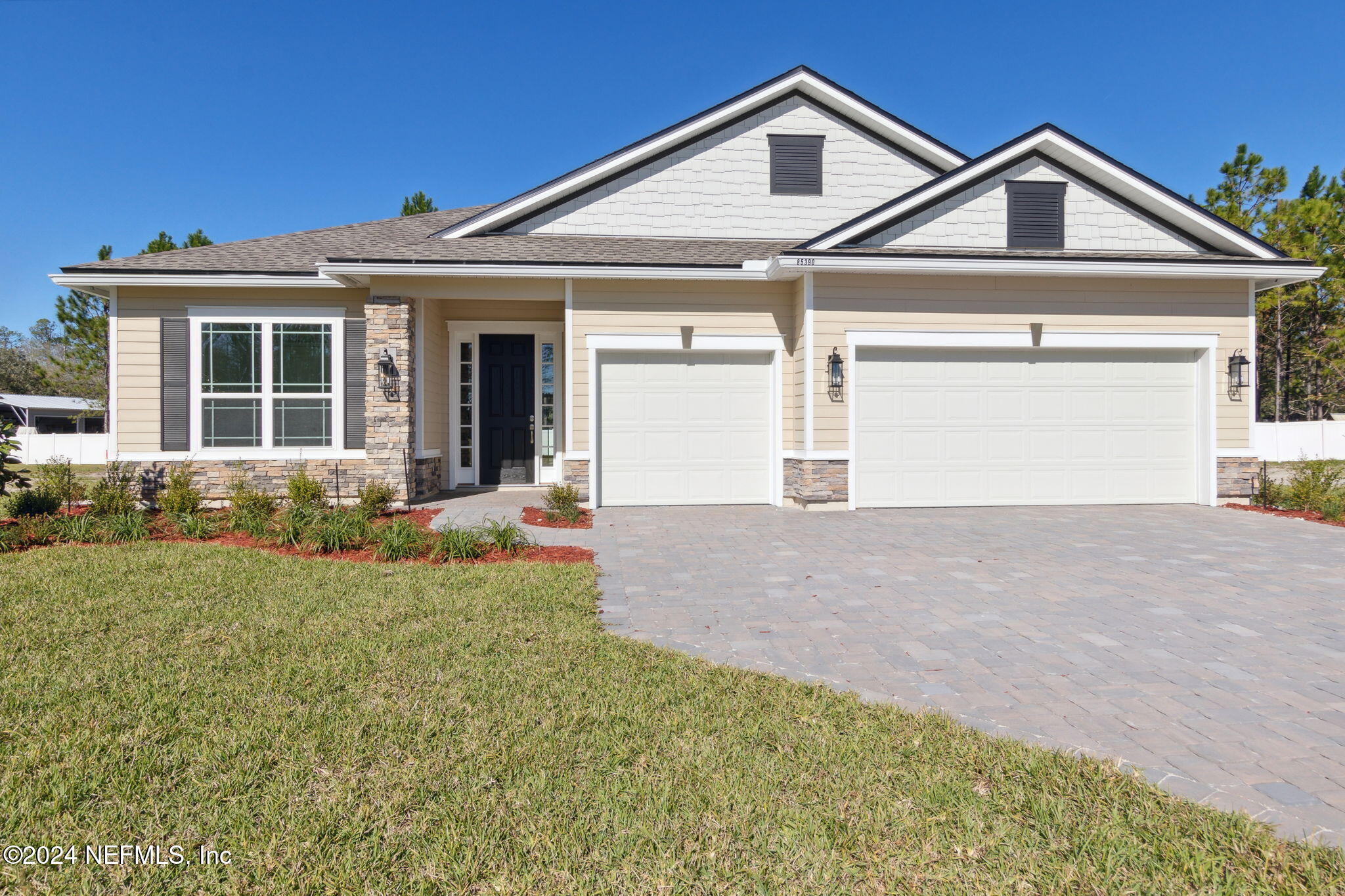 front view of a house with a yard