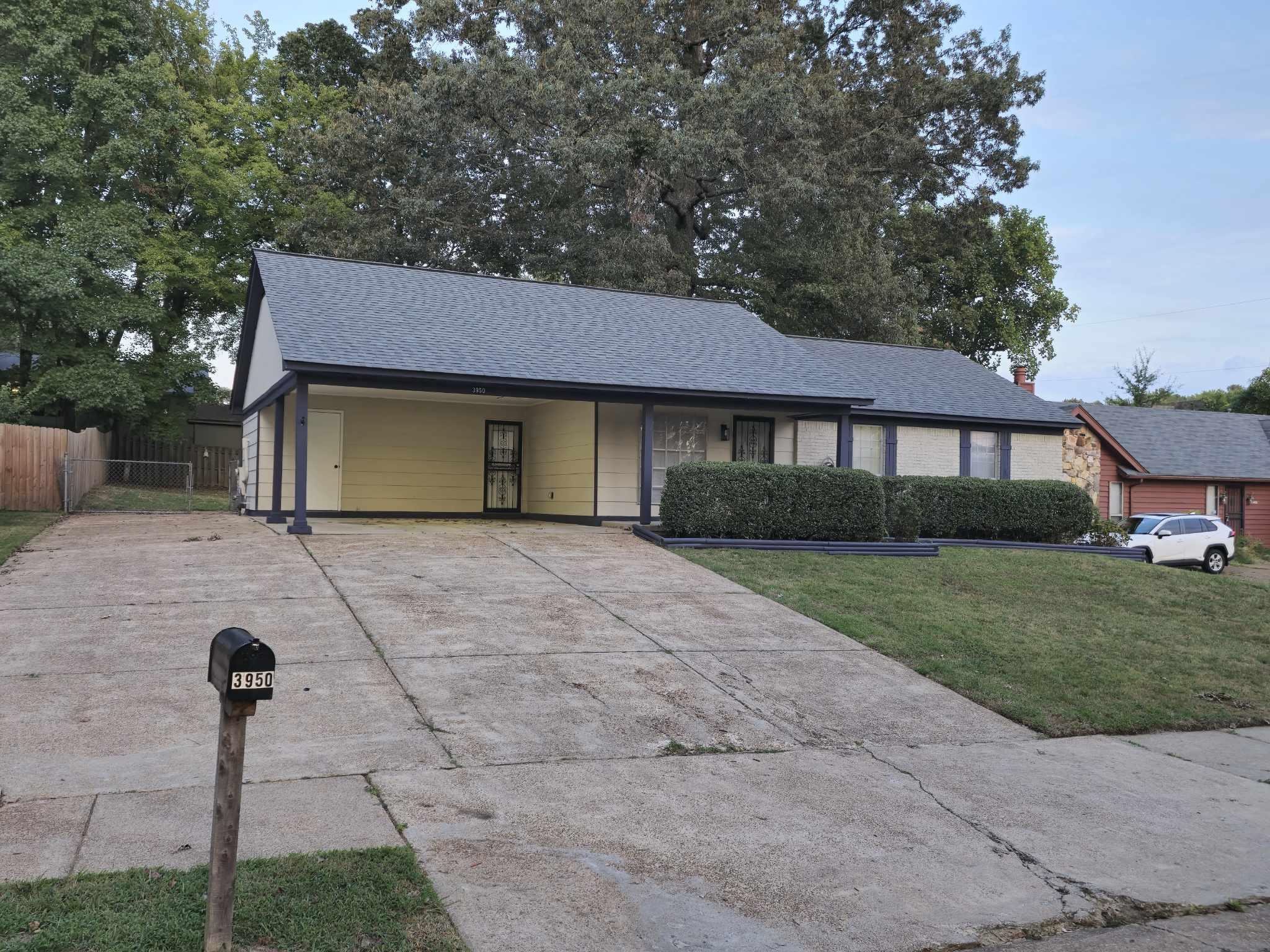 Ranch-style home featuring a front yard