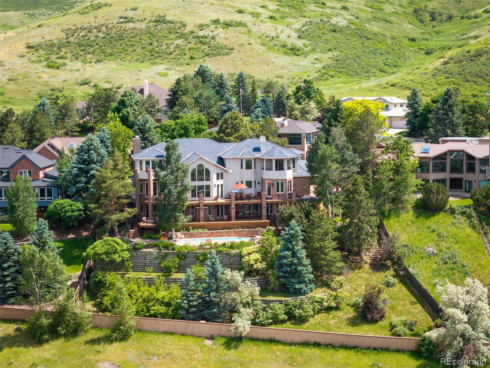 an aerial view of multiple houses with yard