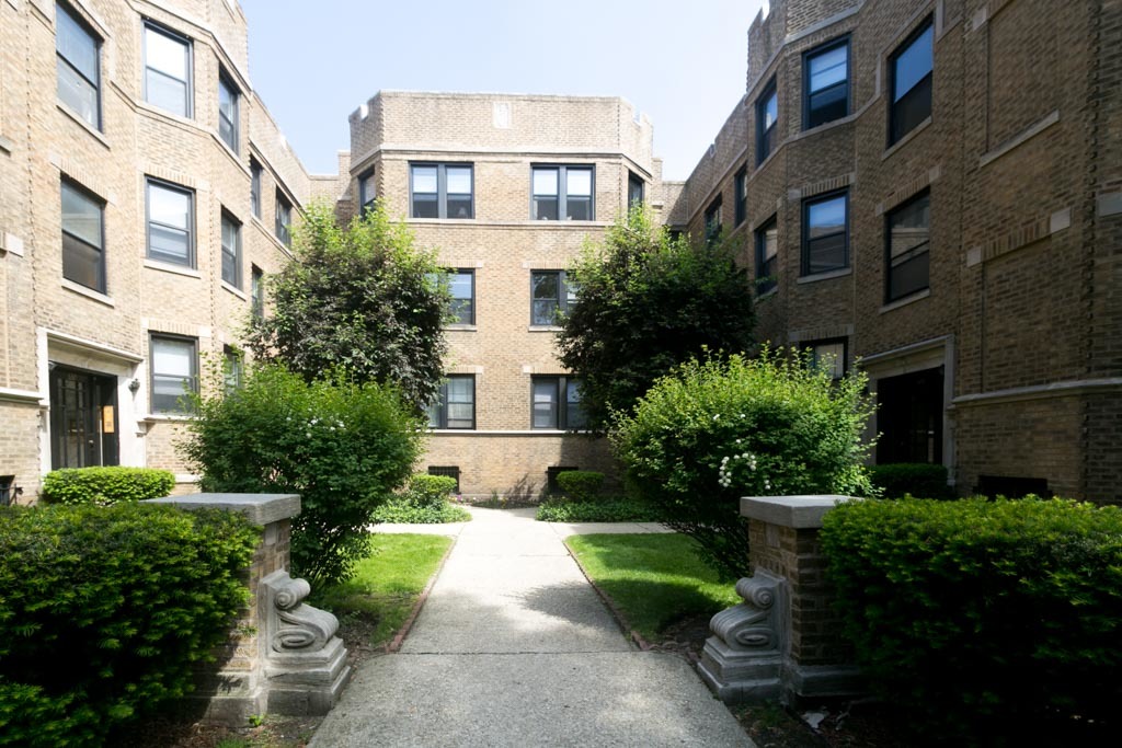 a front view of a building with garden