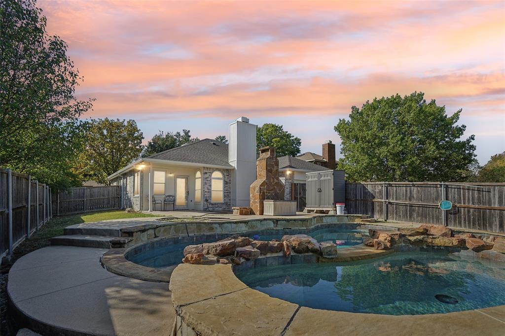 a view of a house with swimming pool and sitting area