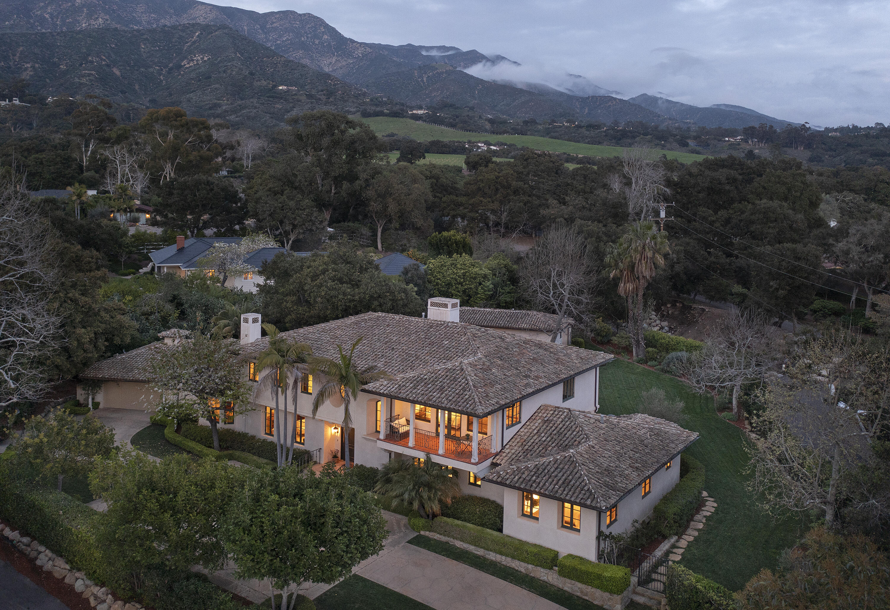 an aerial view of a house mountain view