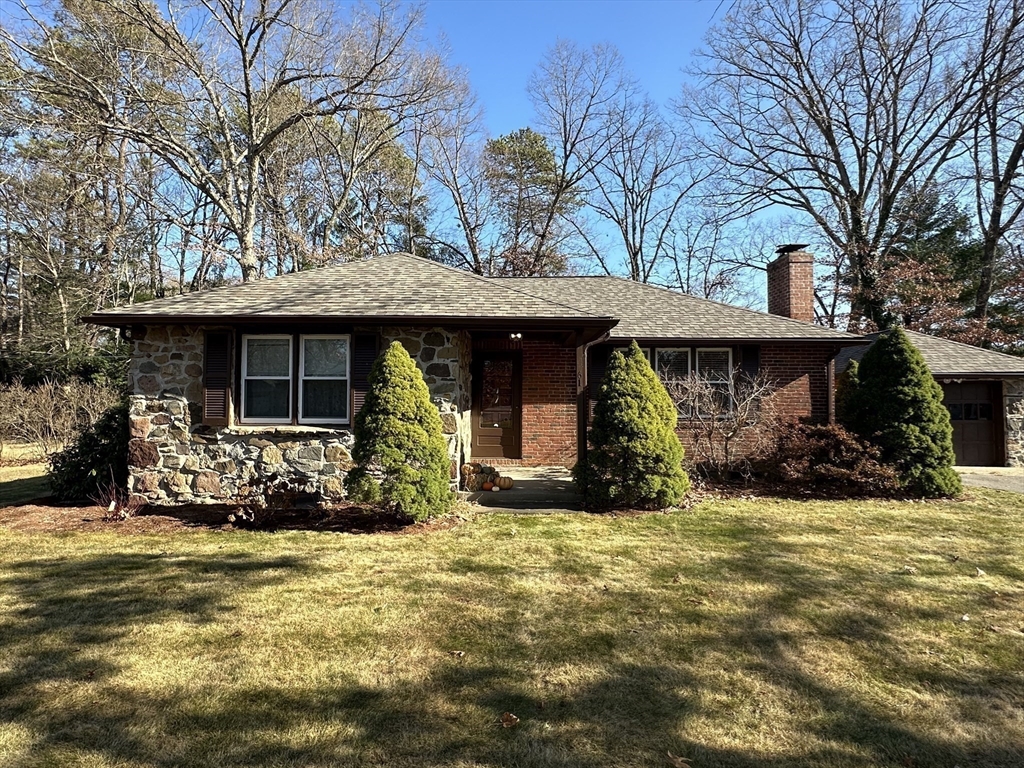 a view of a house with backyard porch and sitting area