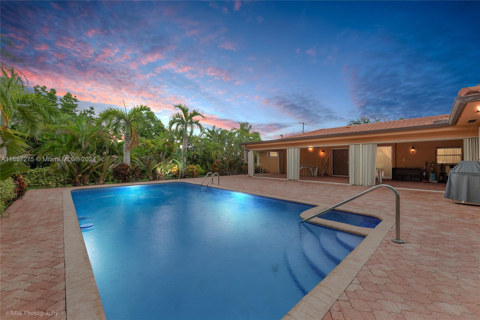 a view of a swimming pool with a patio