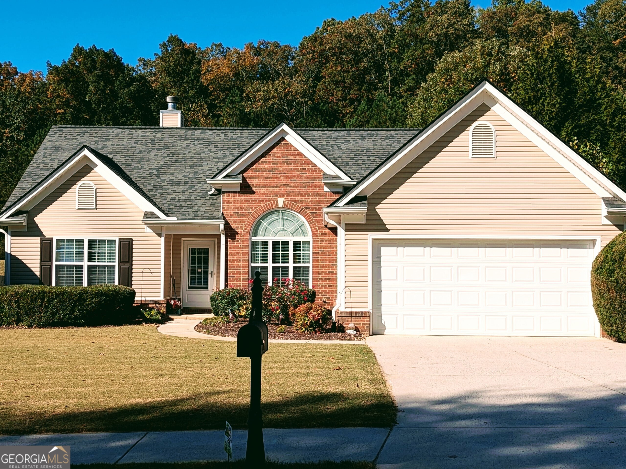 Discover your new oasis! This impeccably maintained ranch offers a level lot, brick accents, and a captivating curved transom window.