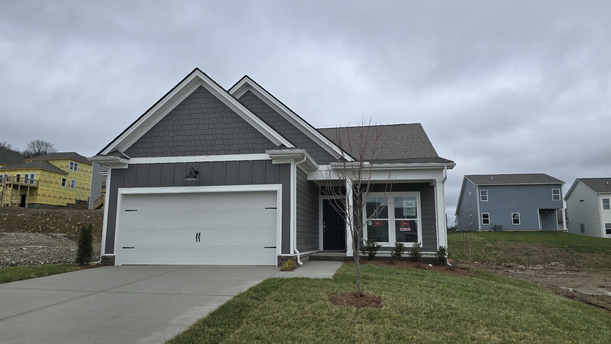 a front view of a house with a yard