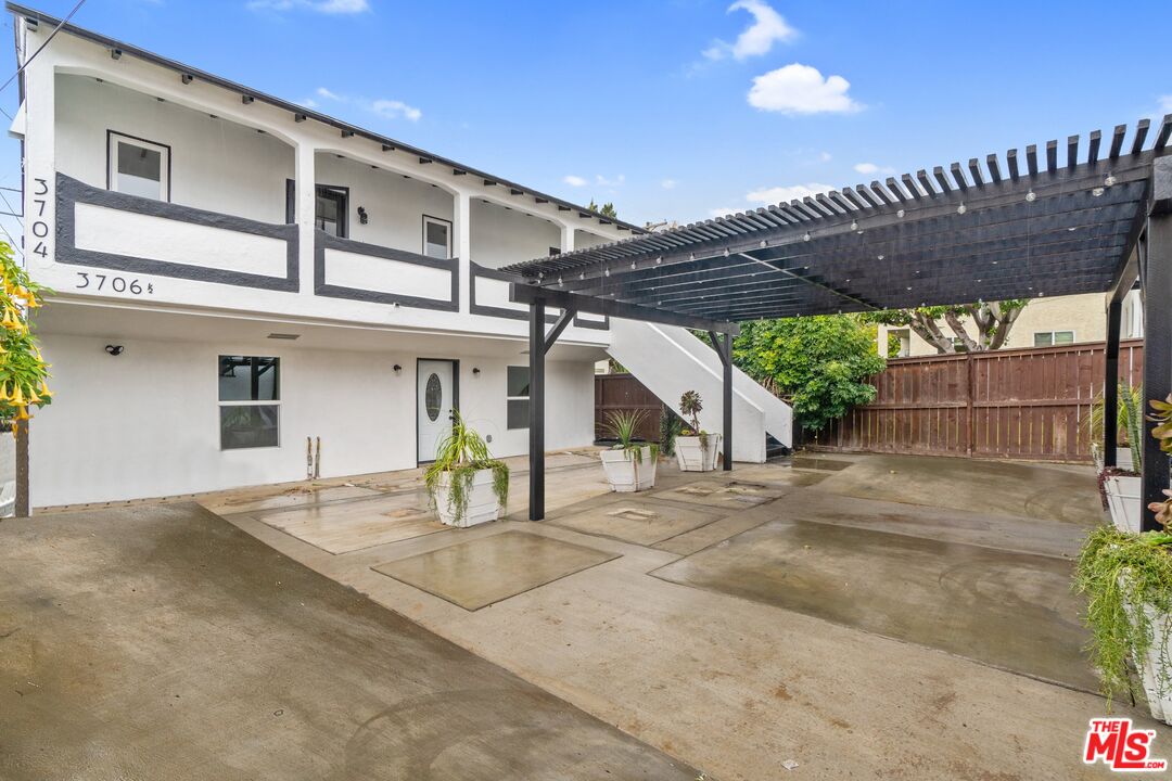 a front view of a house with a garden and entryway